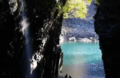Takachiho Gorge, an active volcano crater, and the majestic Kumamoto Castle.